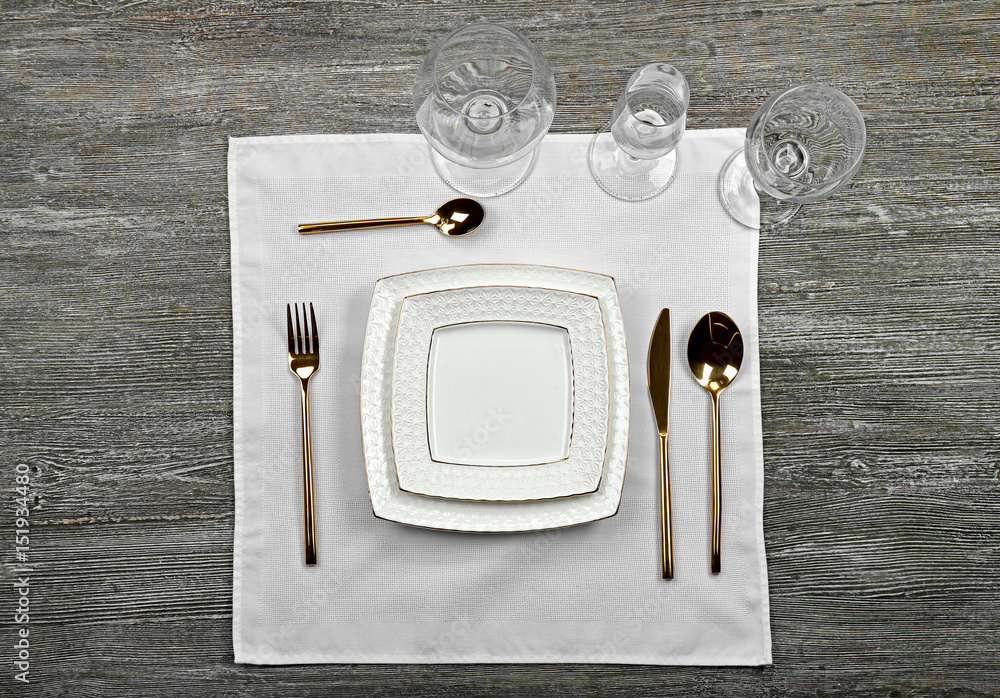 Table setting on wooden background