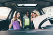 © F8  \ Suport Ukraine - Three Women have fun together in the car after shoping