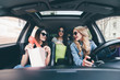 © F8  \ Suport Ukraine - Three women in the car have fun after shopping and sales