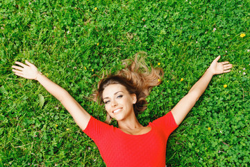 Woman in red dress on grass