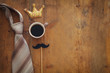 funny mustache cup of coffee, crown and tie. Father's day concept