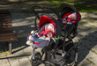 © ondrooo - sleeping twins baby in double stroller