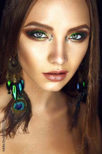 Beautiful woman portrait in american indian style with glamour colorful make up Poster