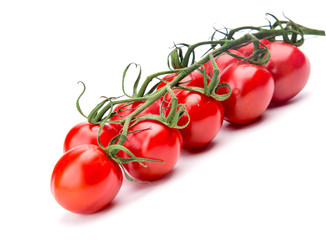 Branch of ripe cherry tomatoes over the white background