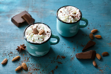 Poster - Cups of hot cocoa drink on wooden table