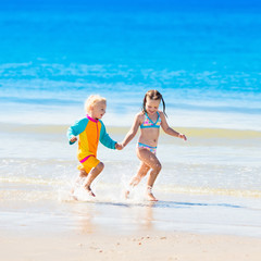 Wall Mural - Kids run and play on tropical beach