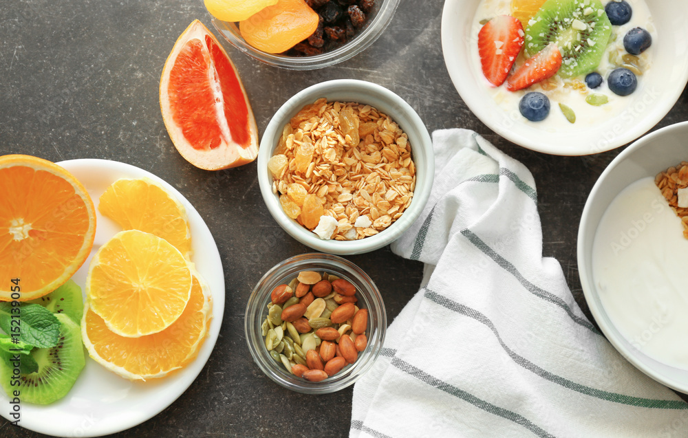 Composition with tasty yogurt and different products on table