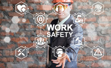 Work Safety First Standard Сonstruction Industry Business Concept. Health Protection, Personal Security People On Job, Hazards, Regulations. Man In Helmet Presenting Work Safety Icon On Virtual Screen