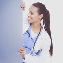 A female doctor with a blank billboard.