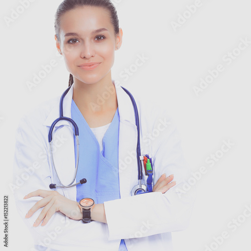 Woman doctor with stethoscope standing with arms crossed isolated on a white bac Lerretsbilde