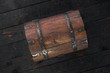 © kucherav - Old closed chest close up on dark wooden table