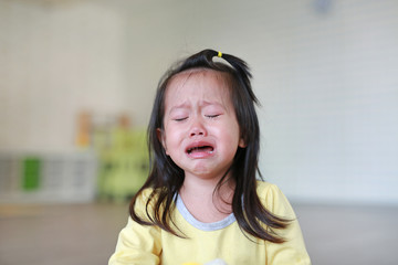 Close up Little kid girl crying with tearful on her face.