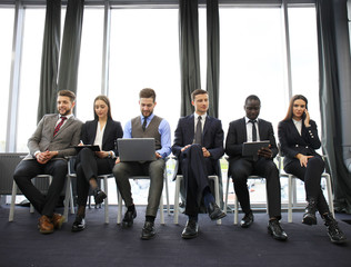 Wall Mural - Stressful people waiting for job interview.