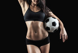 Fototapeta Sport - Beautiful body of fitness model holding soccer ball