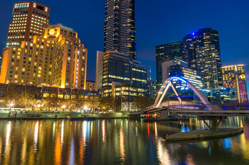 Wall Mural - Beautiful cityscape at night with bridge across river