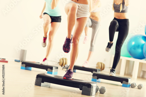 Group of smiling people doing aerobics