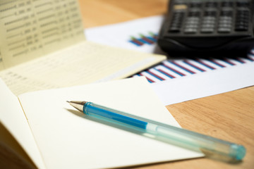 Canvas Print - Background of passbook, note book with pen,calculator and financial graph