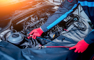 Servicing car air conditioner. Service station.