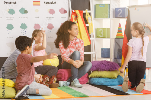 Girl writing an answer on whiteboard Wallpaper Mural