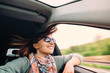 © Soloviova Liudmyla - Woman with flying hair looks from car window