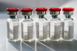 Glass medical vials of biotech drugs.