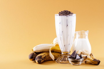 Canvas Print - Milkshake with banana on yellow background