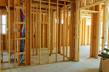 unfinished wood frame building or a house