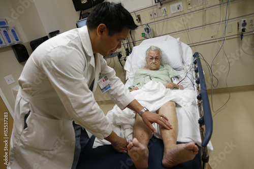 Patient Bush Receives Treatment From Doctor Leon Yeh In The