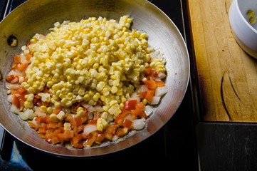 Sweet corn red peppers and onions