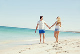 Fototapeta  - Romantic young couple on the beach