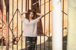 © aleksandr_yu - Beautiful teenager. Outdoor portrait of a pretty young white girl with red curly hair posing near a vintage metal gate. Lifestyle.