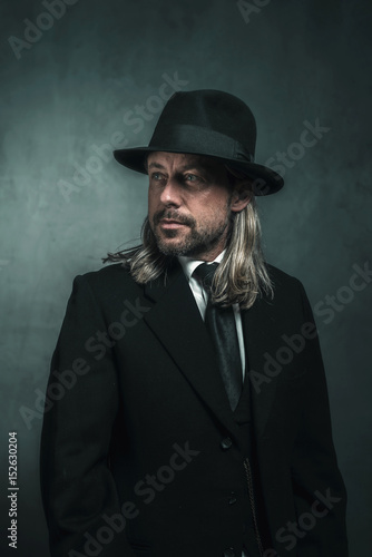 Retro Victorian Style Man With Blond Long Hair And Hat Wearing