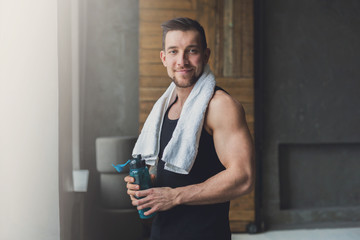 Wall Mural - Handsome young man relax at gym after training