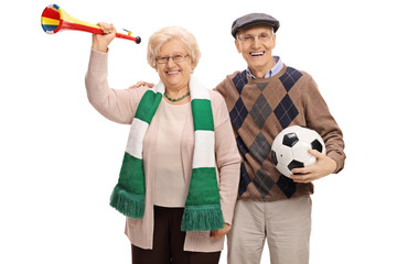 Sticker - Cheerful elderly soccer fans with a trumpet and a football