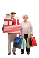 Canvas Print - Elderly man with presents and elderly woman with shopping bags