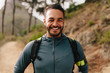 © Jacob Lund - Smiling young male runner on country road