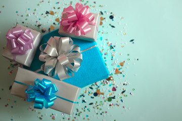 Wall Mural - The gift boxes on a blue festive background