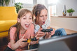 Mother and daughter playing video games