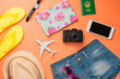 © makistock - Summer traveling concept. Vacation accessories on orange background.