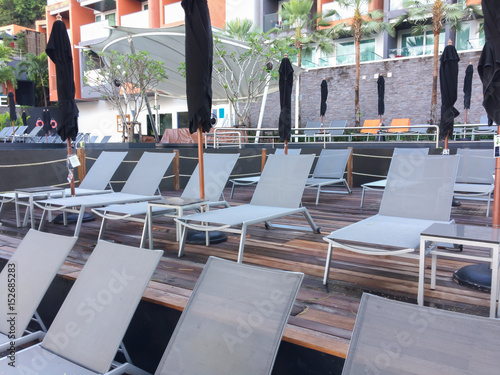 Beautiful Luxury Umbrella And Chair Around Outdoor Swimming