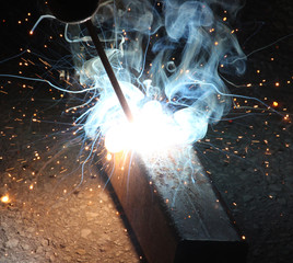 Sparks and jets of smoke when welding