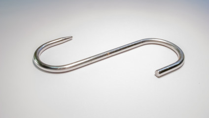 stainles steel meat hook on white