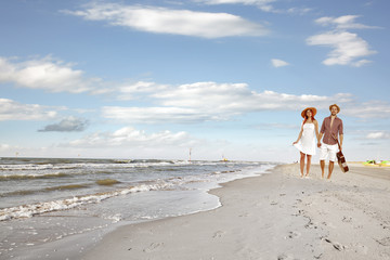 summer day on beach and two lovers 