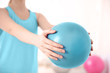 © Africa Studio - Woman with rubber ball in clinic, closeup