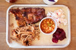 Barbecue food, ribs, pulled pork, beans, coleslaw. BBQ