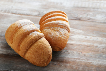 Wall Mural - Fresh croissants on grey wooden table