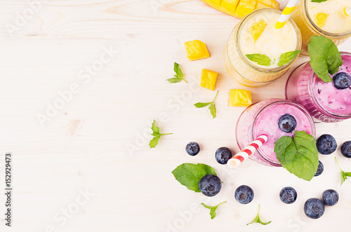 Decorative Border Of Yellow And Violet Fruit Smoothie In Glass