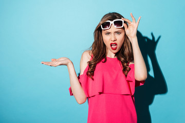 Sticker - Portrait of a frustrated woman in dress looking at camera