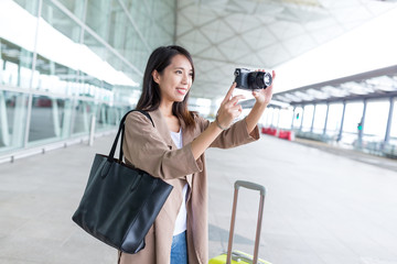 Canvas Print - Woman taking photo with digital camera