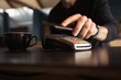 © Wavebreak Media - Man paying bill through smartphone using NFC technology
